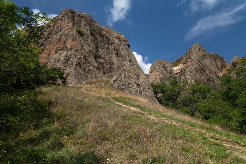 Birtvisi’s rock towers above a green hillside
